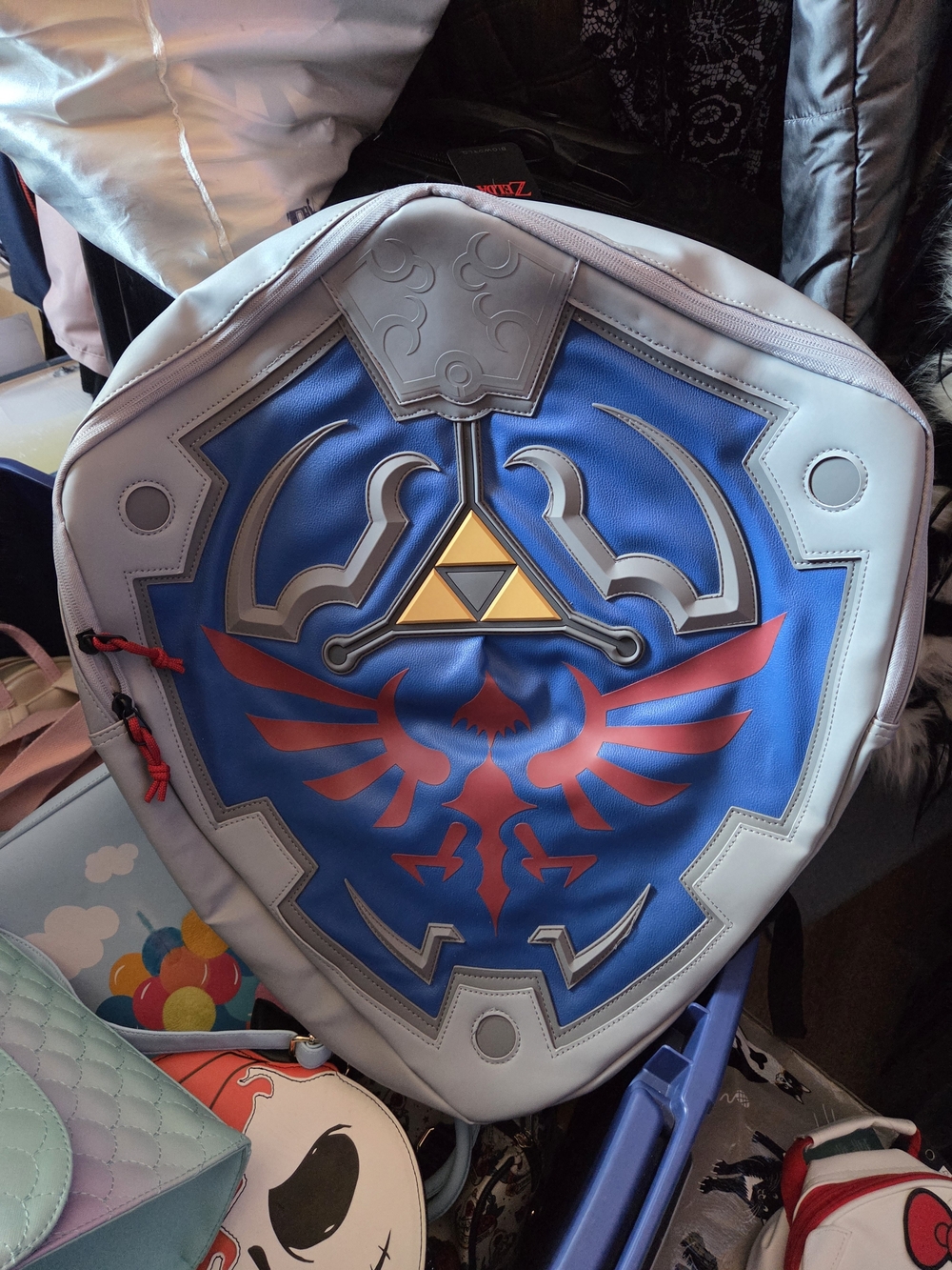 Zelda Shield-shaped Backpack with Blue, Red & Gold Triforce Design